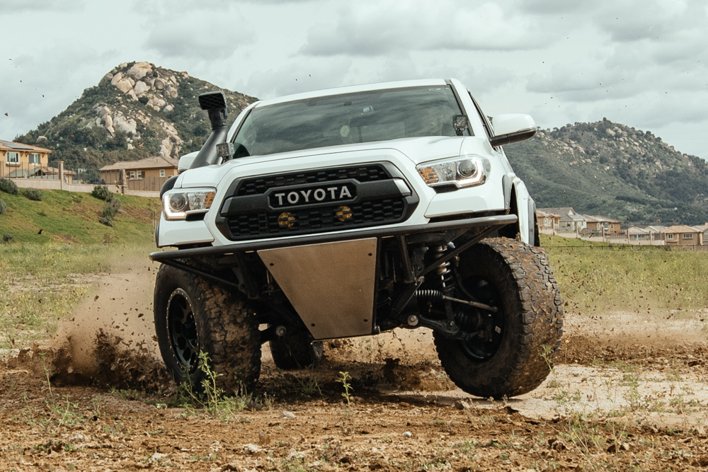 Lifted Super White 3rd Gen Tacoma with K&N Cold Air Intake