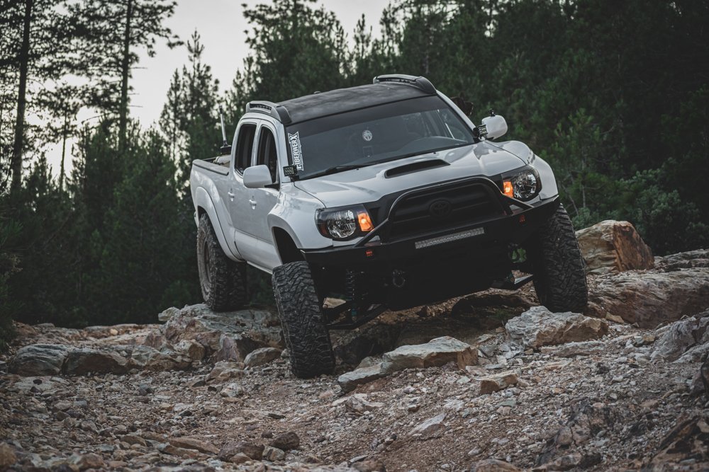 Lifted Super White 2nd Gen Tacoma with Long Travel