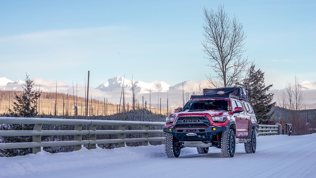 Lifted Barcelona Red Metallic Tacoma with Demello Front Bumper and Prinsu Roof Rack