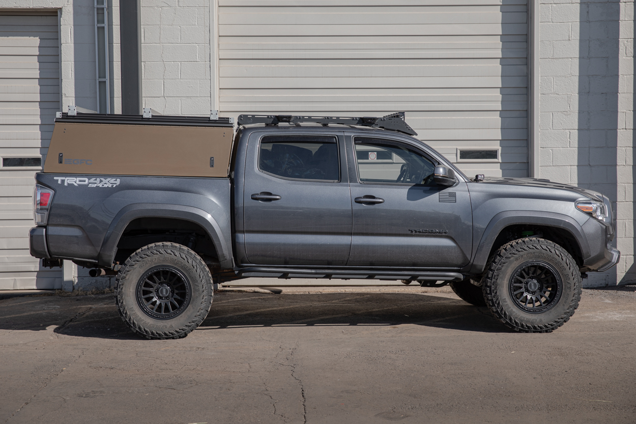 Lifted MGM 3rd Gen Tacoma With Bronze GFC Platform Topper, Prinsu Roof Rack, RRW RR7-H Wheels & True North Fabrications Bolt-On Rock Sliders