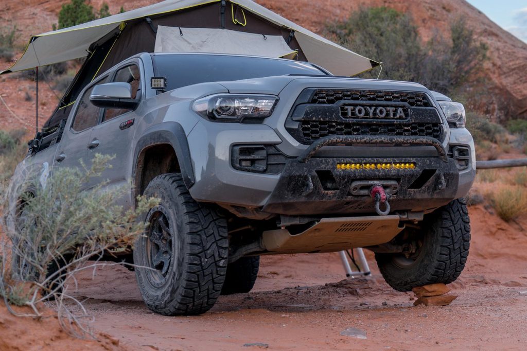 C4 Fabrication low profile front bumper on Tacoma with a rooftop tent camping in the desert