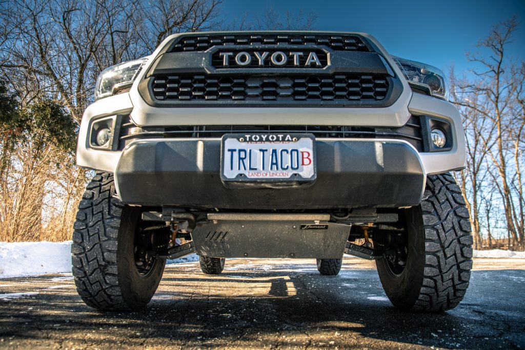Lifted Super White 3rd Gen Toyota Tacoma with Dirt King Fabrication Performance Lower Control Arms