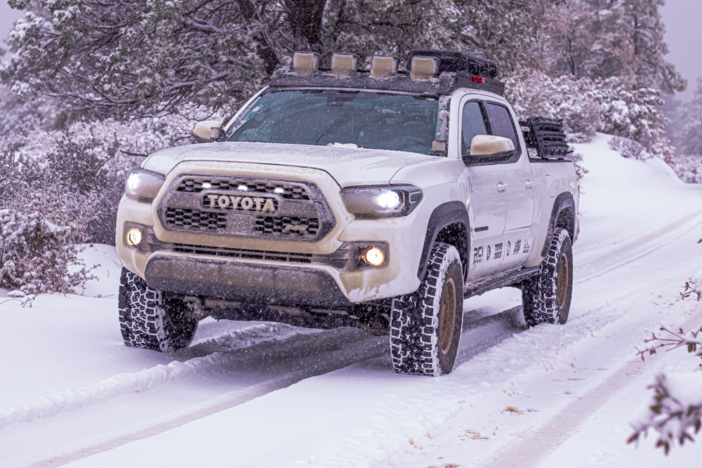Super White 3rd Gen Tacoma with AL Offroad Aluminum Roof Rack & Toyo Open Country AT3s in the Snow