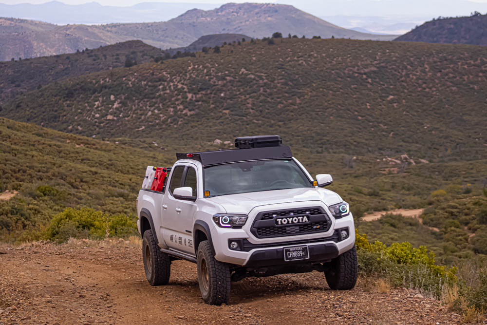 Lifted Super White Tacoma with AL Off-Road Aluminum Roof Rack and Toyo Open Country AT 3s