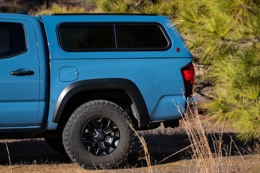 Leer 100R Truck Cap on Cavalry Blue 3rd Gen Toyota Tacoma.