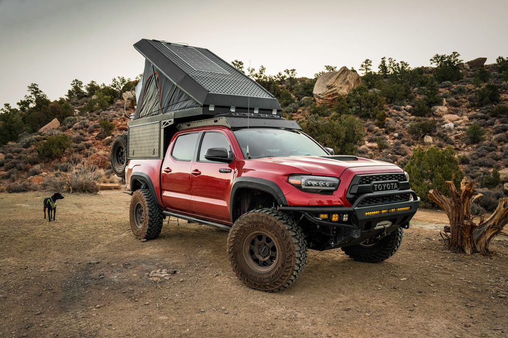 Long Travel 3rd Gen Tacoma with Fiberglass Fenders & Bedsides with AluCab Canopy Camper & C4 Fabrication Hybrid Front Bumper