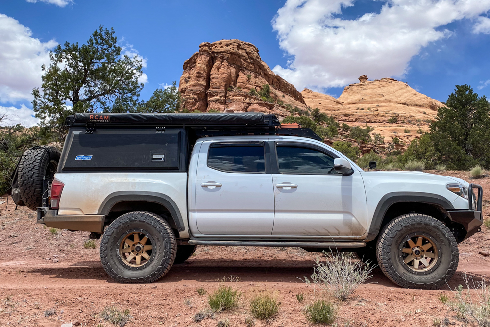 Lifted Super White 3rd Gen Tacoma with Super Pacific Camper & Stealth Custom Series SR8 Wheels