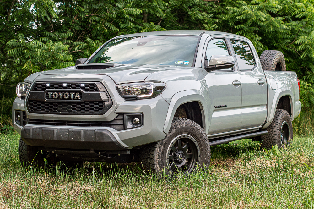Lifted Cement 3rd Gen Tacoma with LED Raptor Lights, Fuel Wheels & Truck Bed Spare Tire Mount