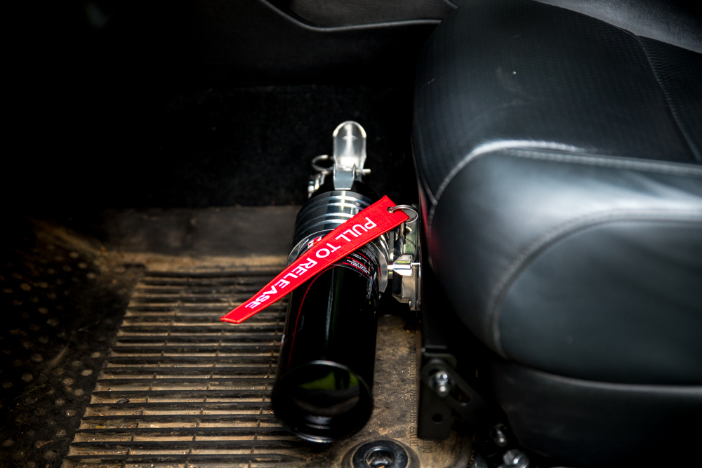 H3R Performance HalGuard Fire Extinguisher Mounted on Universal Seat Mount in Toyota Tacoma