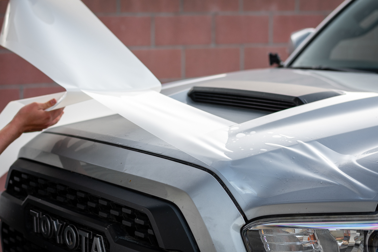 Applying Lamin-X Invisible Bug Guard Clear Protective Film on Toyota Tacoma Hood