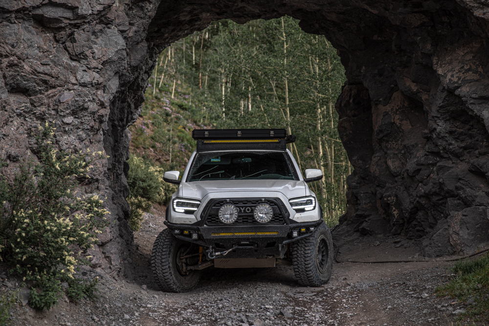 Lifted 3rd Gen Tacoma with AlphaRex Alpha Black Headlights, AL Off-Road HD Roof Rack & Relations Race Wheels Hybrid Front Bumper