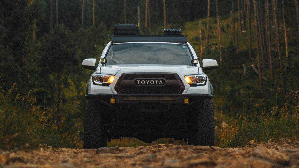 Lifted Super White 3rd Gen Tacoma with Relentless Fabrication Front Bumper