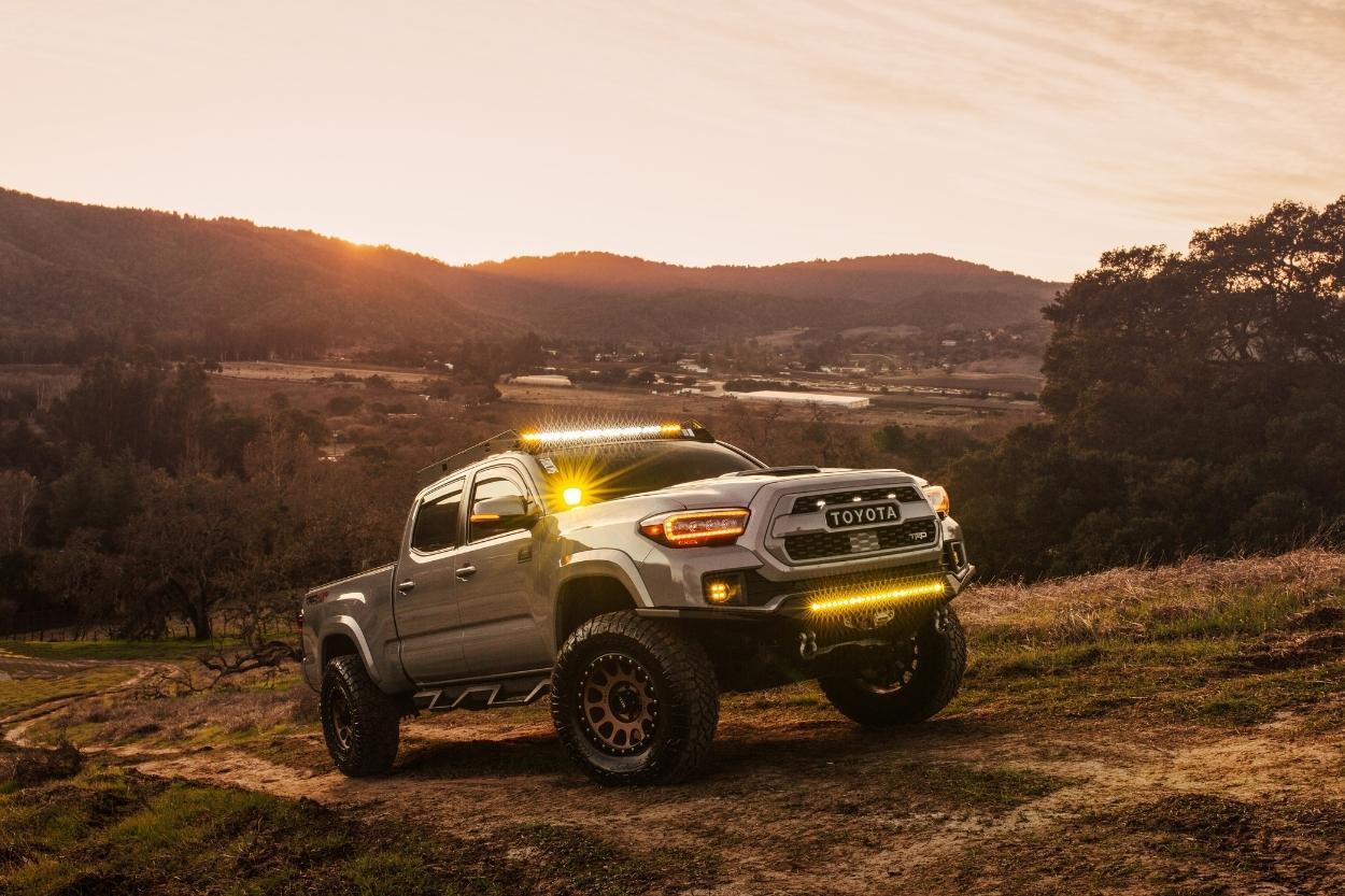 Lifted Long Bed Cement 3rd Gen Tacoma with AlphaRex NOVA Series Headlights