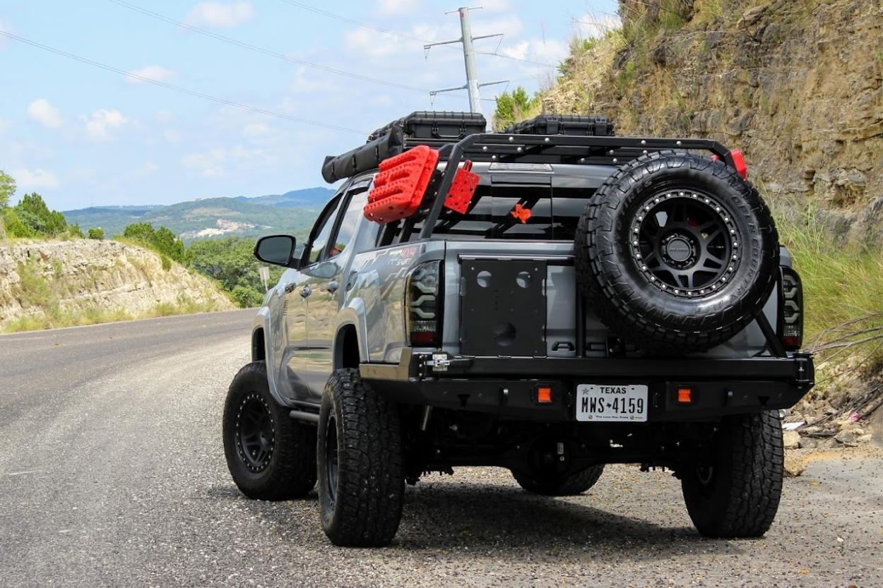 3rd gen tacoma with At The Helm Fabrication rear bumper with swing out