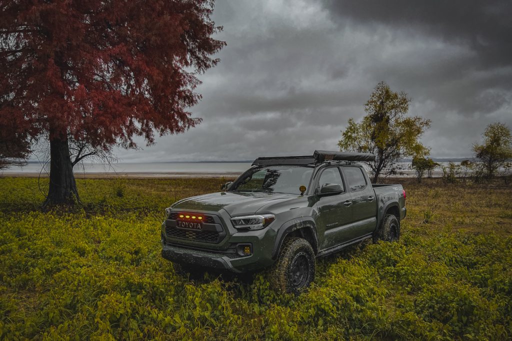 Army Green 3rd Gen Toyota Tacoma with TRD Pro Grille & Amber/Orange LED Raptor Lights