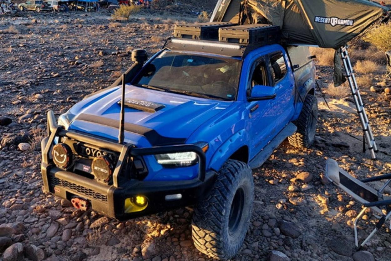 Voodoo Blue Toyota Tacoma with 37" Maxxis Trepadors., ARB Summit Front Bumper, STEDI LED Lights & Desert Armor RTT