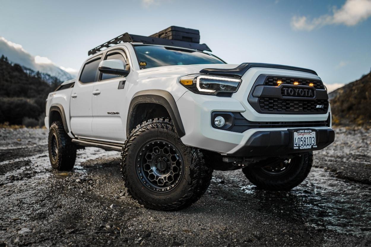 Lifted Super White 3rd Gen Tacoma with KMC Wheels, TRD Pro Grille & Prinsu Roof Rack