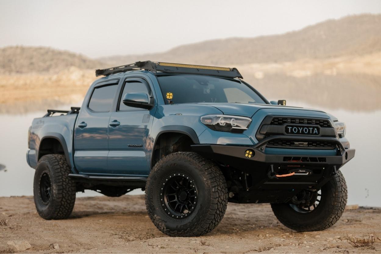 Lifted Cavalry Blue 3rd Gen Toyota Tacoma with CBI Front Bumper, Prinsu Roof Rack & Falcon Wheels