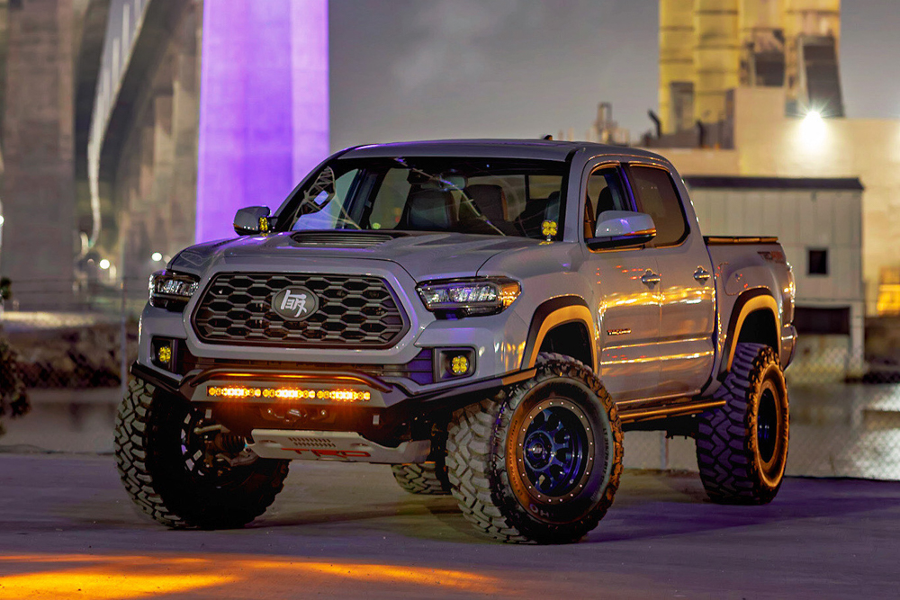 Lifted 3rd Gen Tacoma with Slim, High Clearance Front Bumper, SCS Wheels & FabZone Rock Sliders