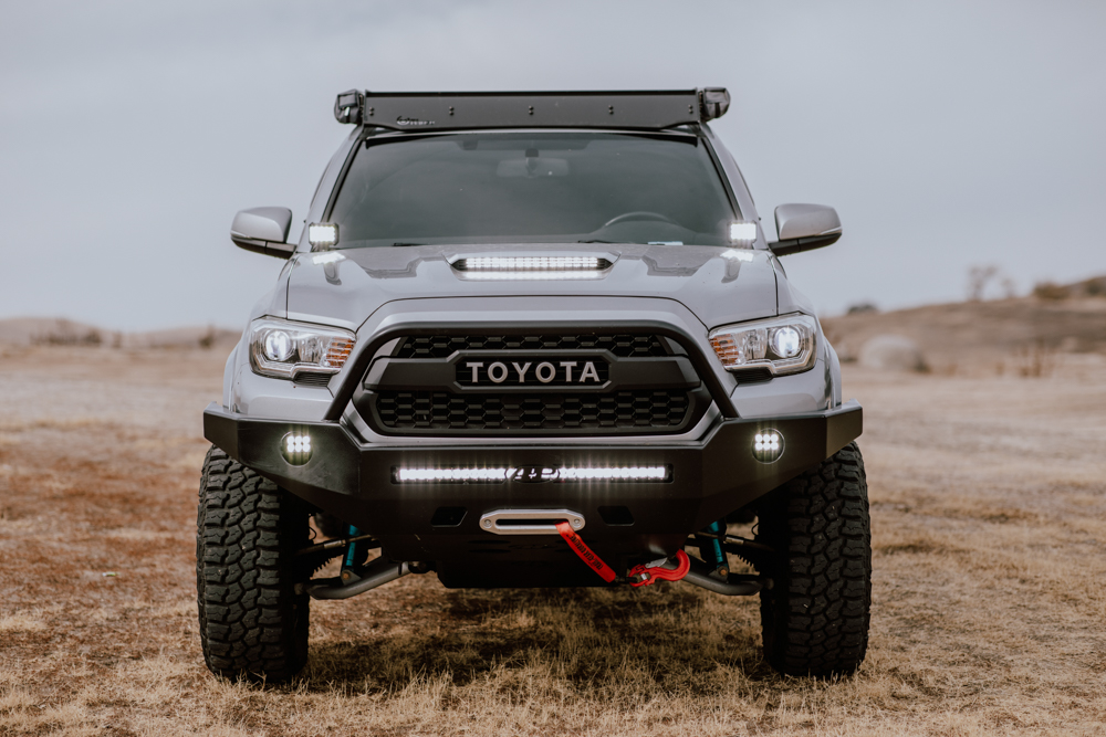 Lifted Cement 3rd Gen Tacoma With All-Pro Apex Plate Front Bumper With Center Hoop