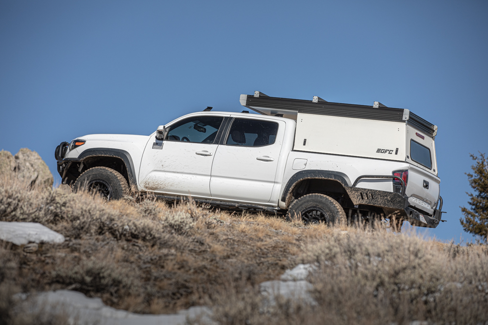 Lifted 3rd Gen Toyota Tacoma with Truck Bed Camper with Integrated Rooftop Tent