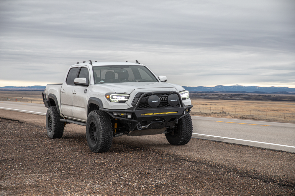 Lifted Super White 3rd Gen Tacoma with TreadWright Guard Dog M/T Tires