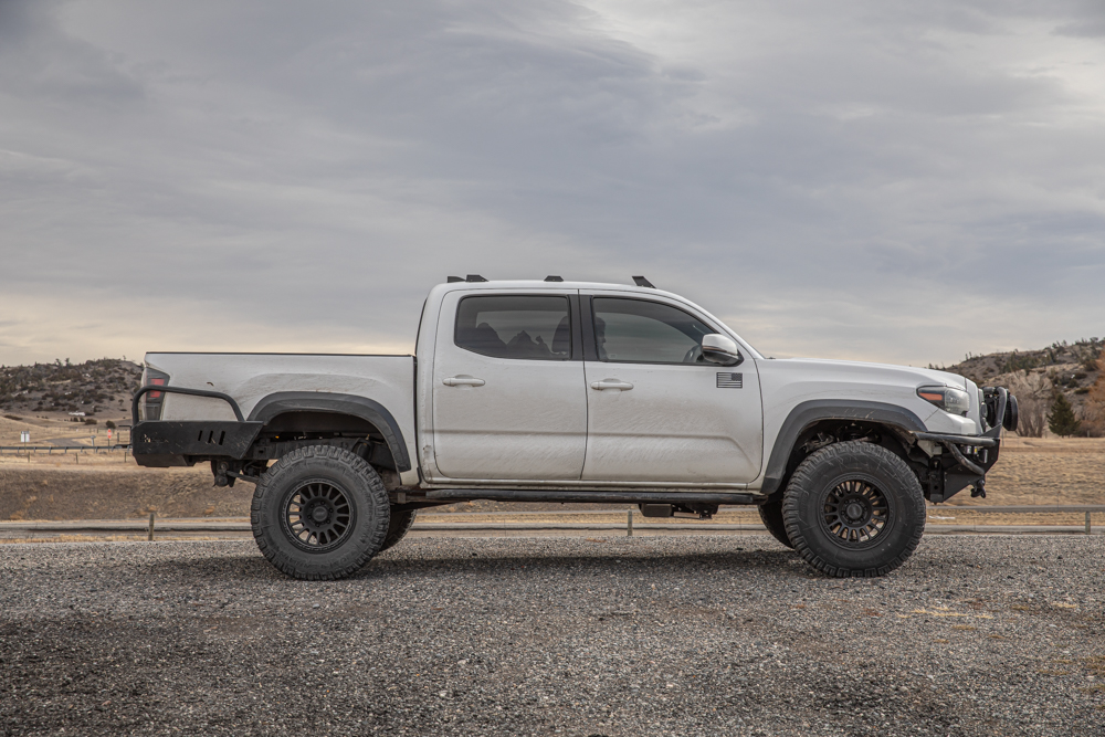 Lifted White Tacoma with 33" Tires, C4 Fabrication Rear Bumper & Relations Race Wheels Rock Sliders