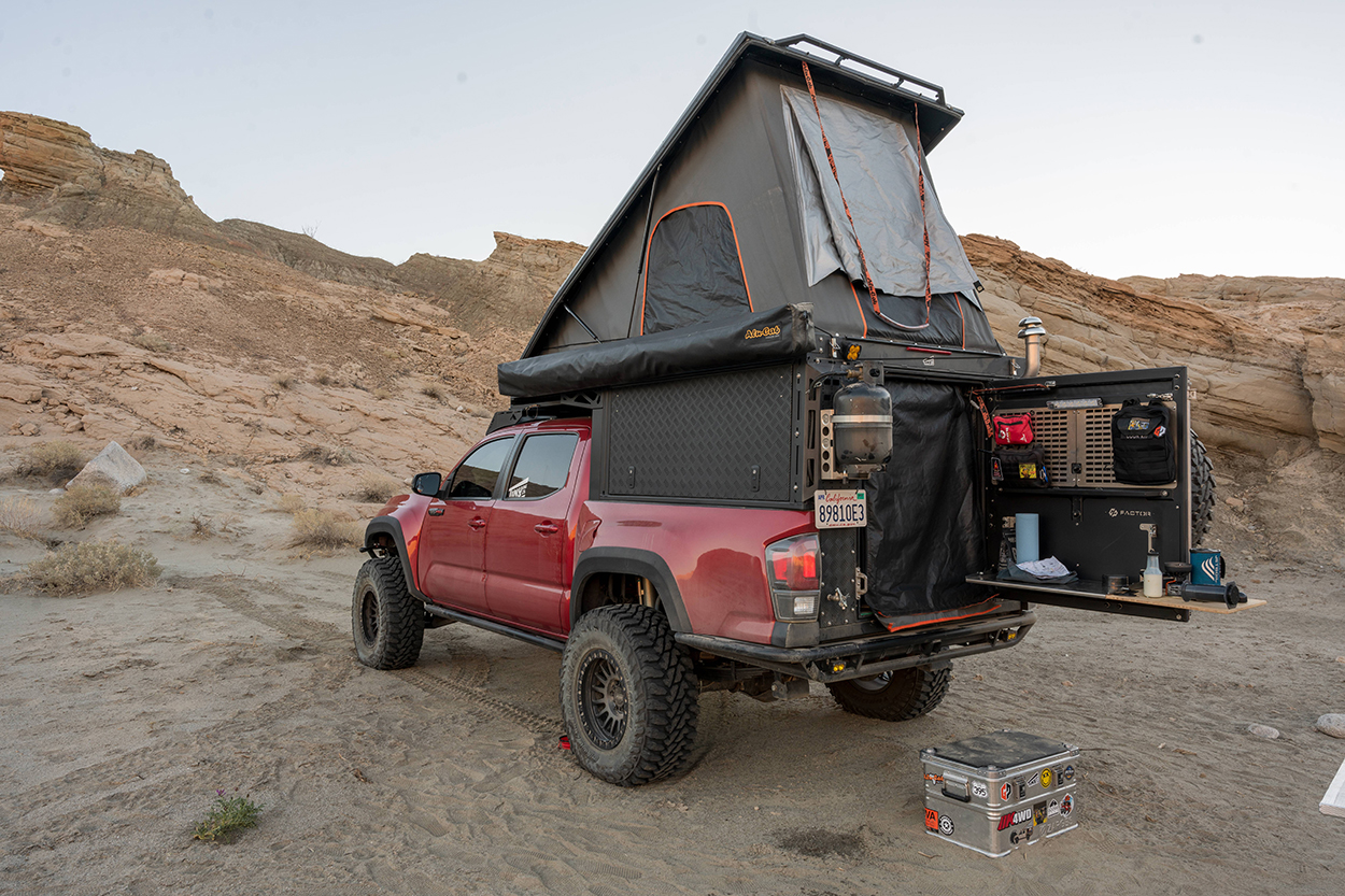 Alu-Cab Canopy Camper on Long Travel 3rd Gen Toyota Tacoma