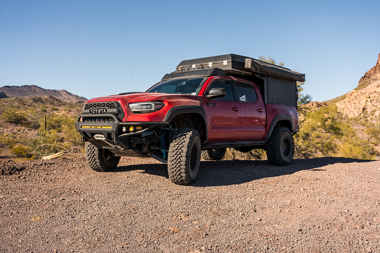 Barcelona Red Metallic 3rd Gen Tacoma with Front & Rear Fiberglass Fenders & Bedsides, Total Chaos Long Travel & Alu-Cab Canopy Camper