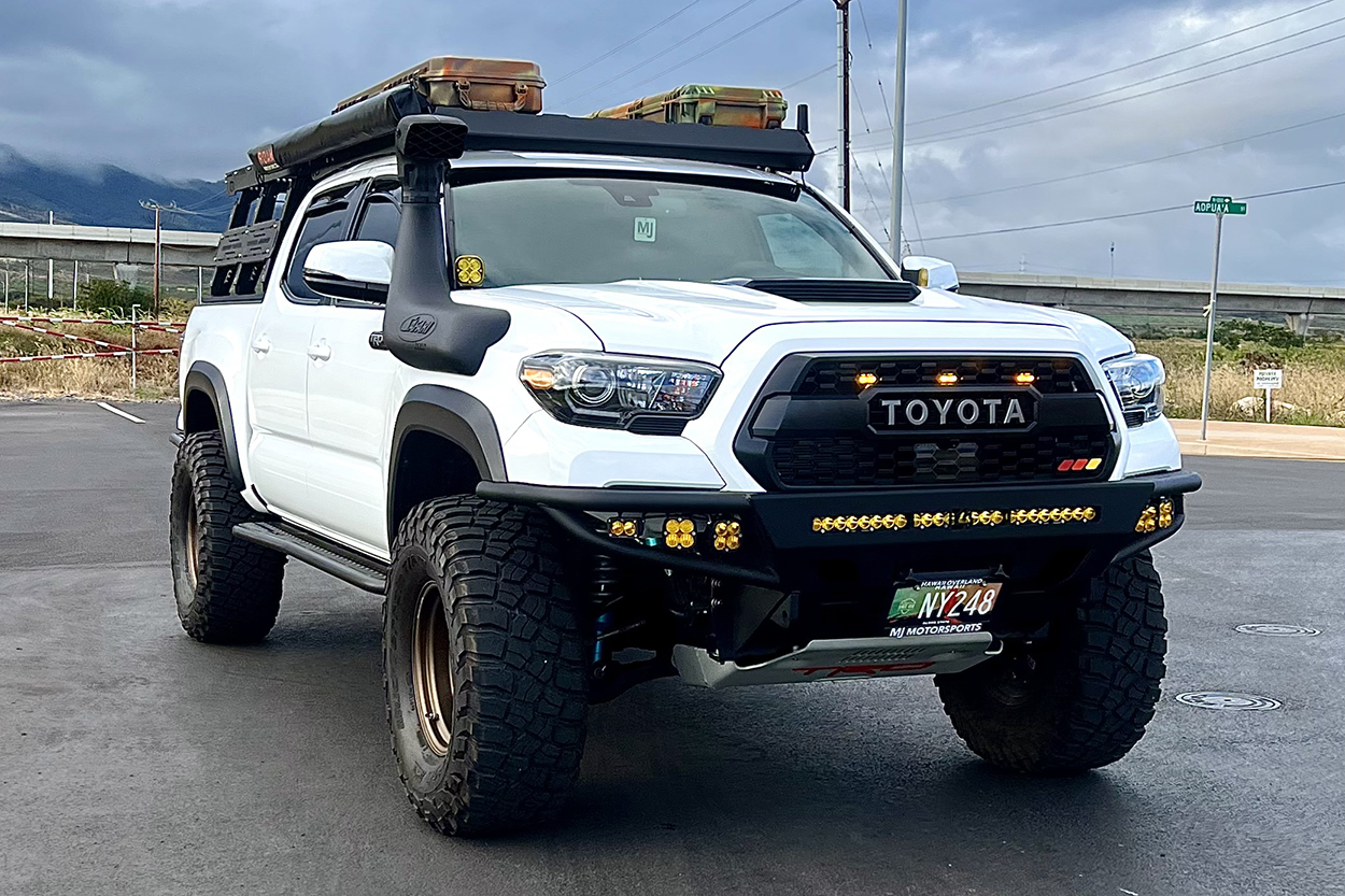 White TRD Pro Tacoma with C4 Fabrications hybrid tubular and roam awning