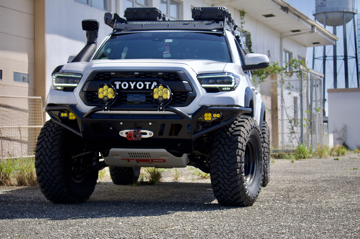 White TRD Off Road Tacoma with Toyo Open Country MTs