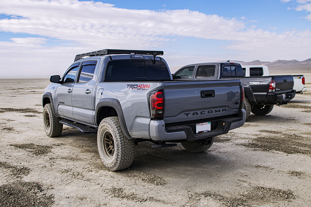 Cement Tacoma with AlphaRex Pro-Series Smoke Red Tail Lights