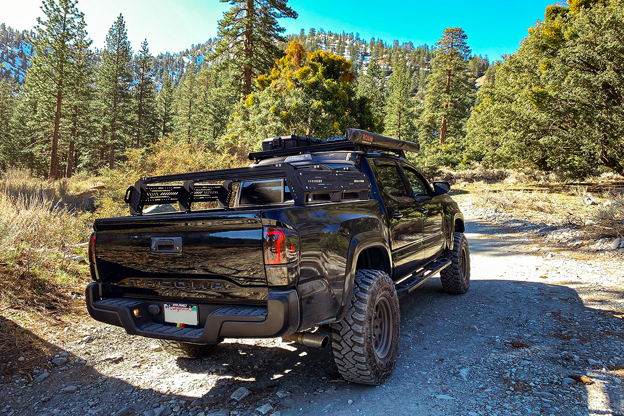 Black Tacoma with Cali Raised LED Raptor Style Tail Lights