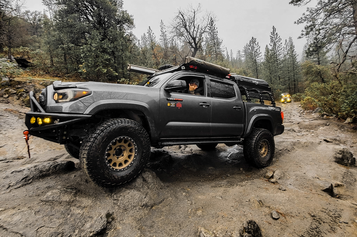 Magnetic Grey Metallic 3rd Gen Tacoma with Falken Wildpeak A/T3W Tires On Bronze Wheels, Full Hybrid Bumper