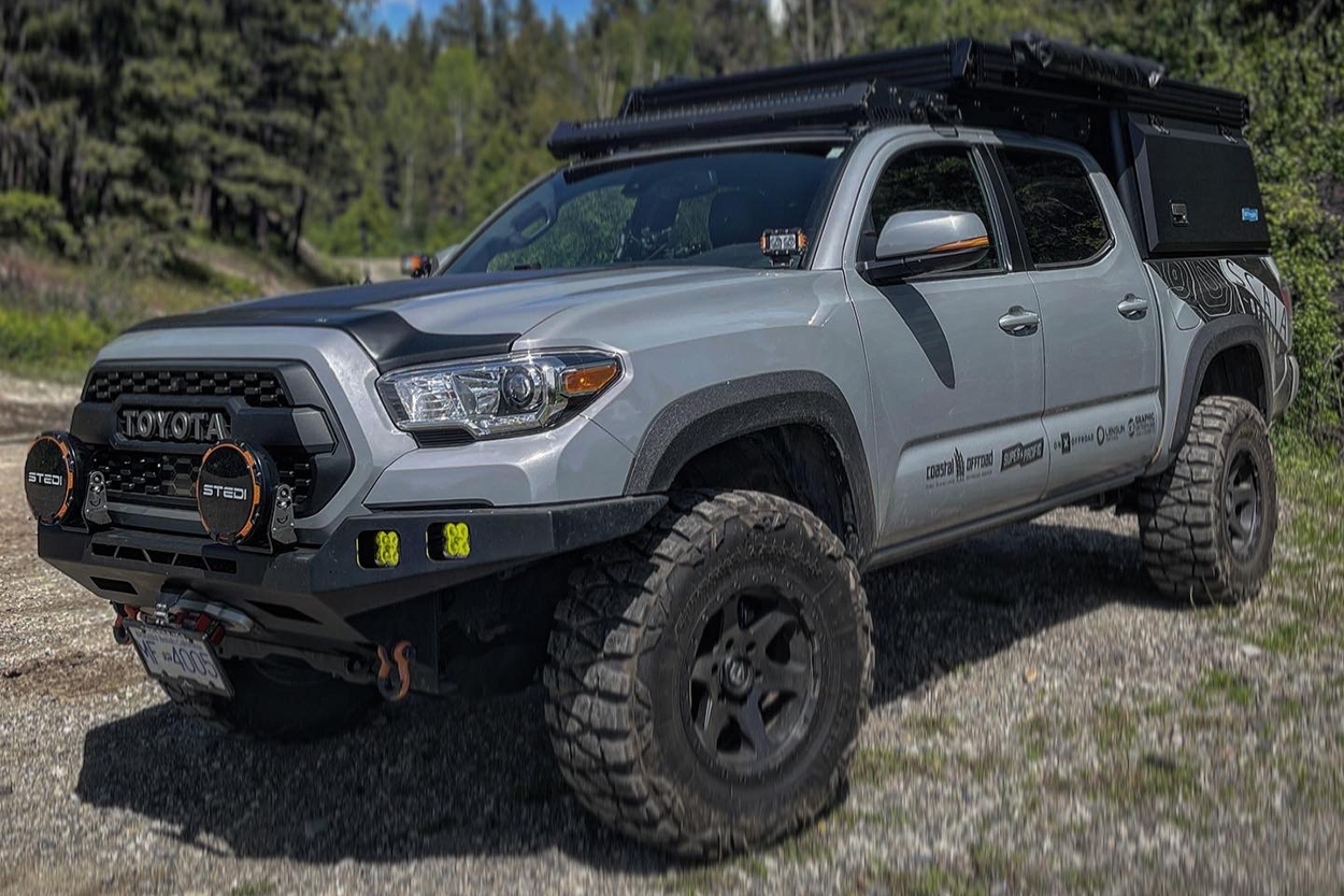 Cement Toyota Tacoma With 33" Nitto Mud Grappler Tires