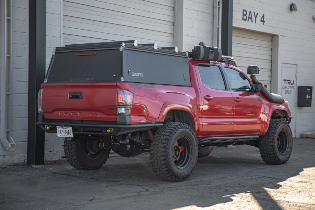 Black GFC Platform Topper Camper Shell On Red Lifted 3rd Gen Tacoma