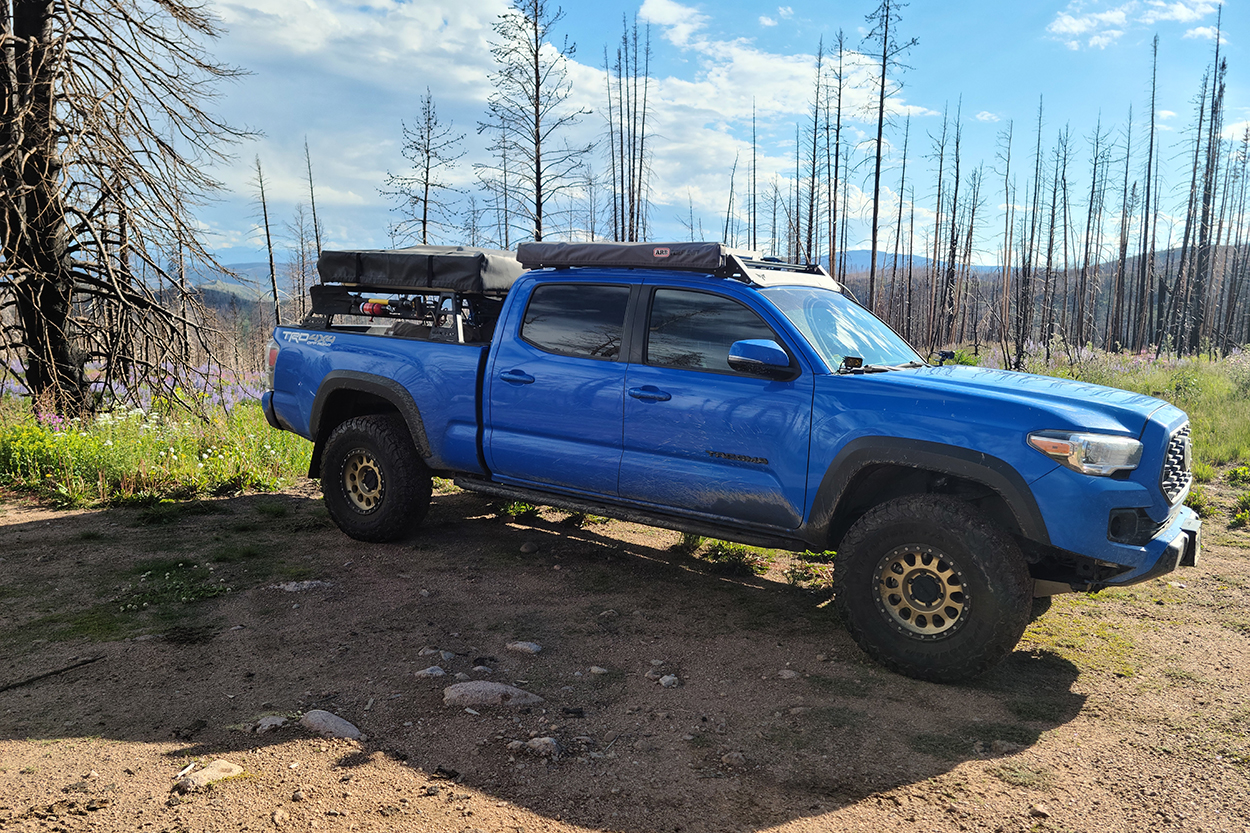 Voodoo Blue 3rd Gen Tacoma With Bronze Wheels & Bed Rack