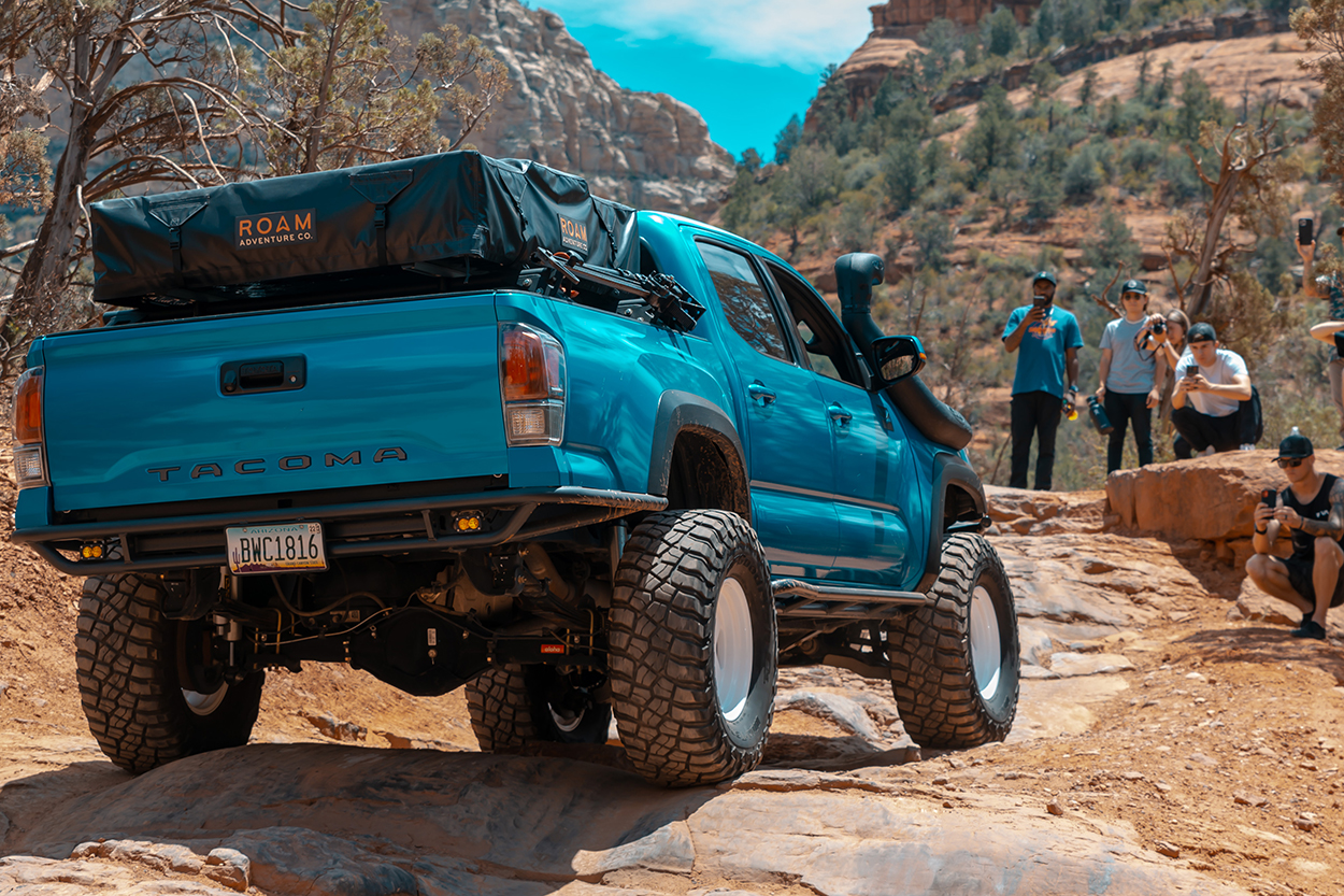 Custom Aqua Blue Wrapped 3rd Gen Tacoma With Outgear Solutions HC Rear Bumper & Roam RTT