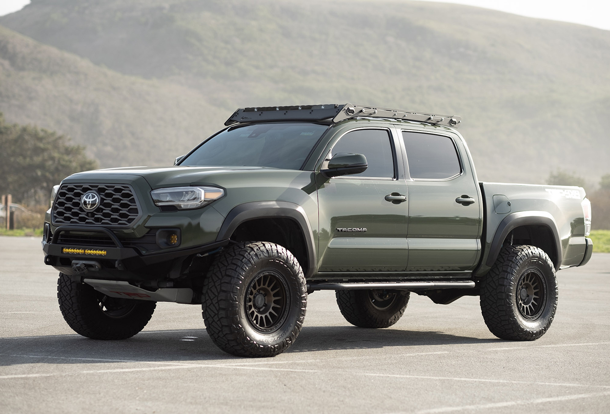 Army Green Tacoma with Cali Raised LED Off-Road 0-Degree Step Sliders