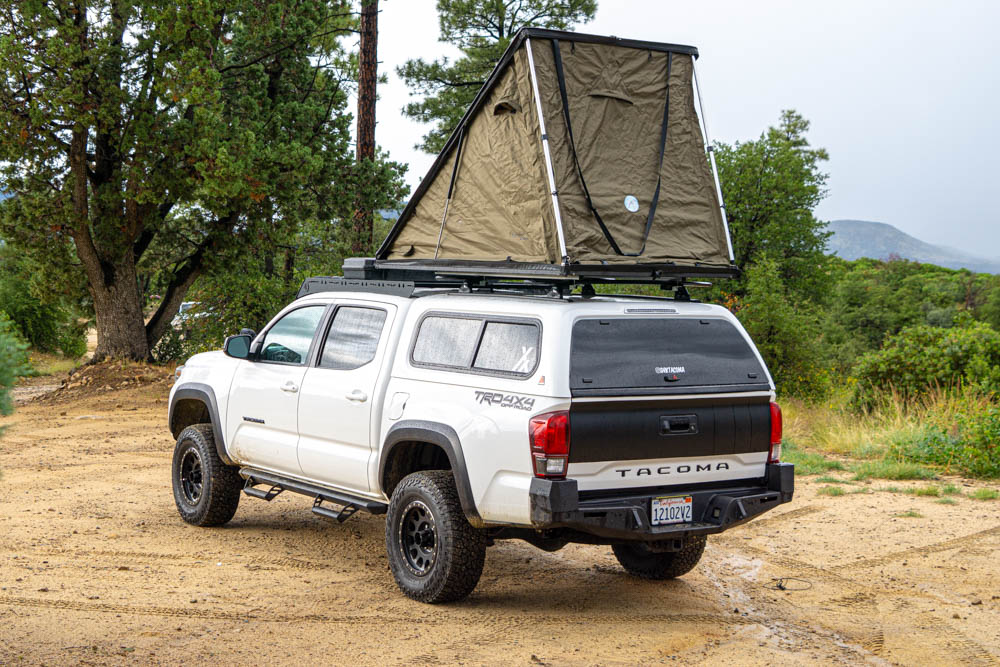 Lifted Super White 3rd Gen Tacoma With White ARE Camper Shell & Inspired Overland Lightweight Rooftop Tent