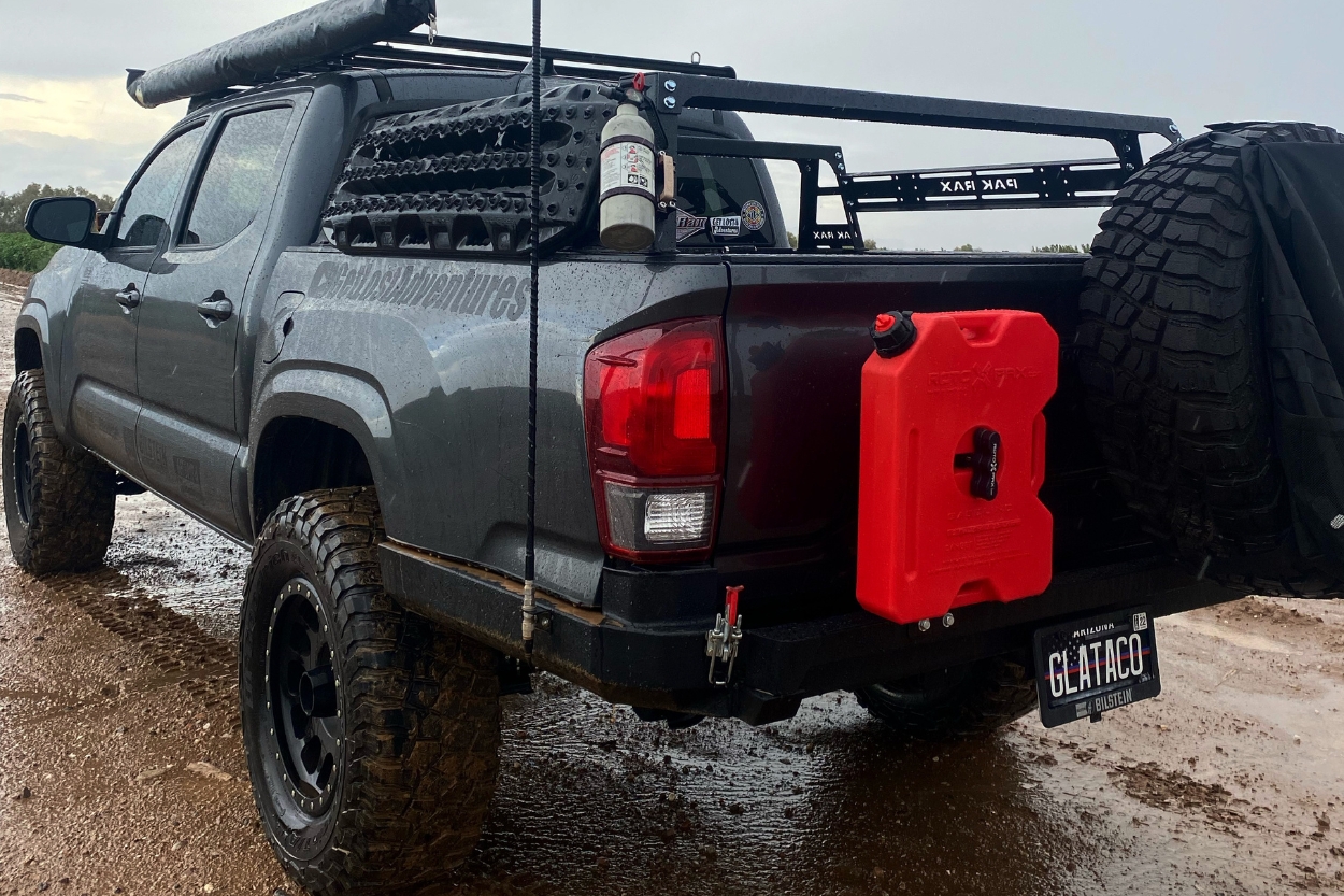 Tacoma with Maxtrax Recovery Boards on Pak Rax Bed Rack