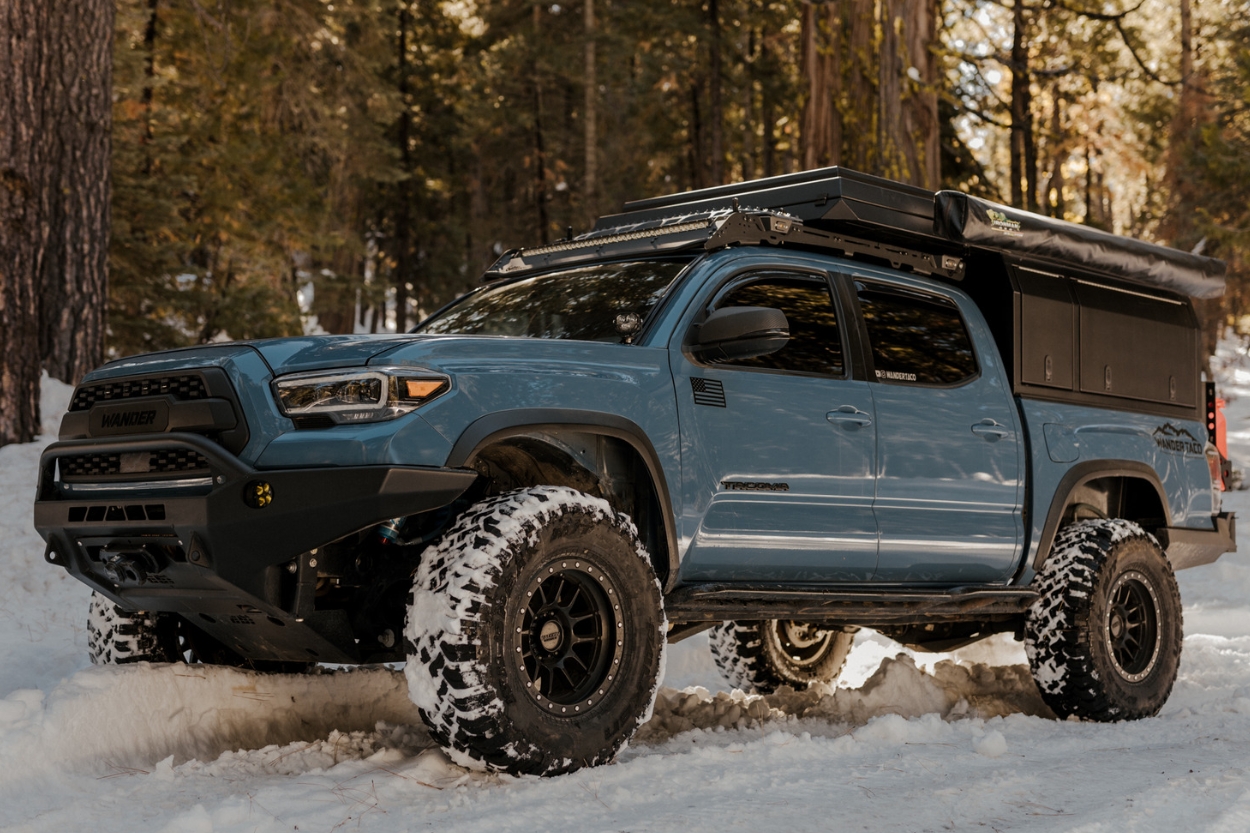 Cavalry Blue Toyota Tacoma With Truck Bed Camper & Anzo Headlights