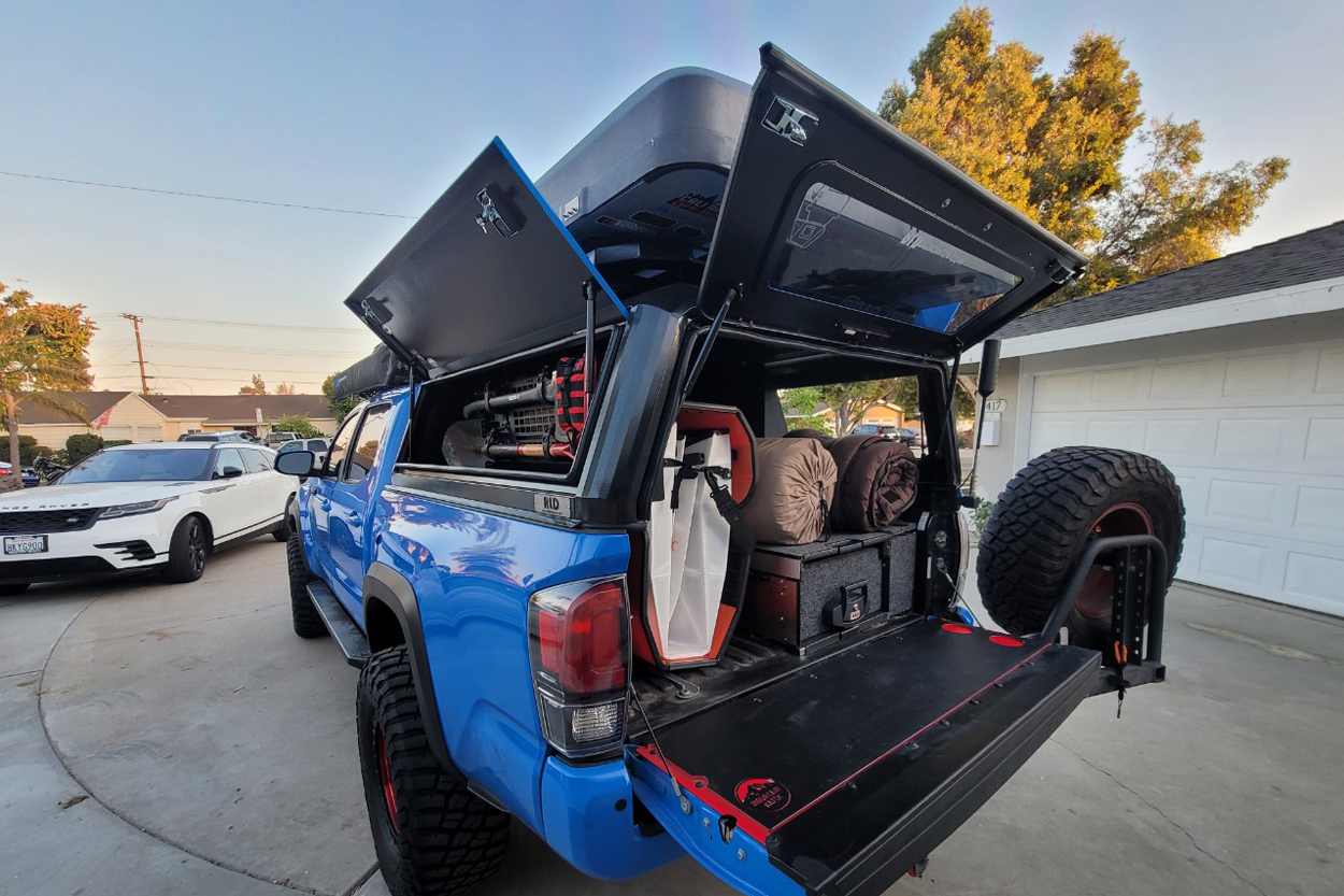 RLD Design Stainless Steel Truck Bed Canopy With Rooftop Tent On Voodoo Blue 3rd Gen Tacoma With Windoors and ARB USA Storage Drawer System 