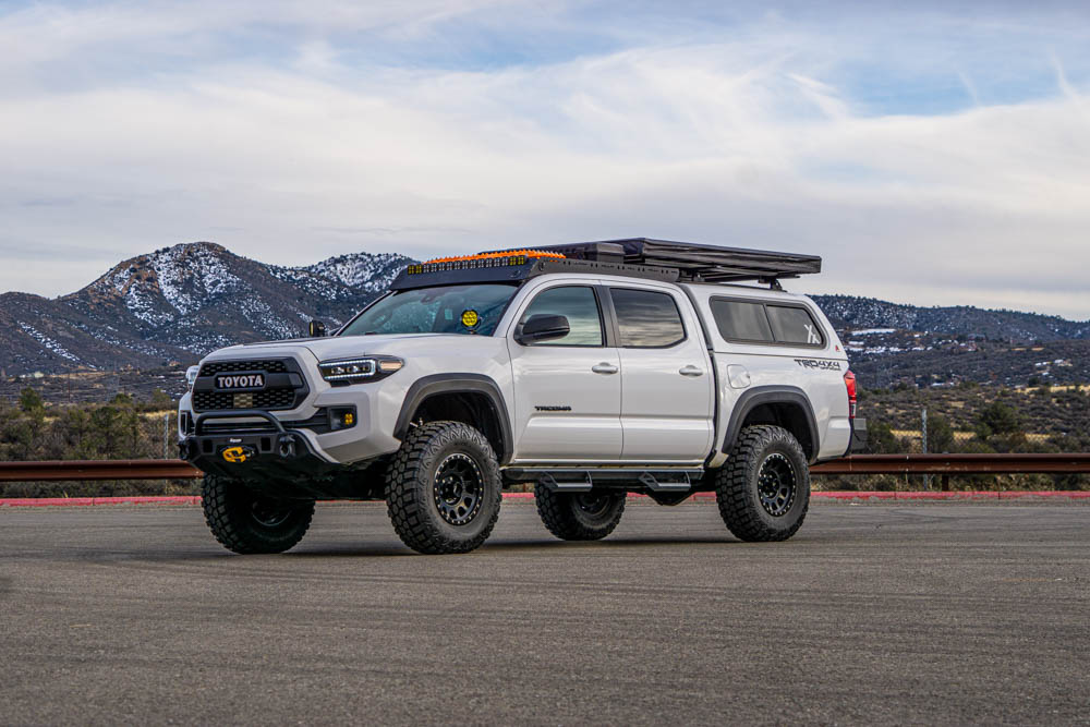 Lifted 3rd Gen Tacoma With ARE Truck Topper & Inspired Overland Lightweight RTT