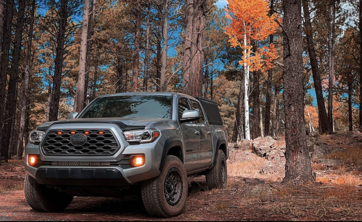 3rd Gen Silver Tacoma With Alu-Cab Explorer Canopy & Amber LED Lights