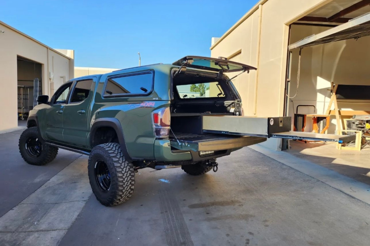 3rd Gen Army Green Tacoma with OverLander WoodWorks Inc. Drawer Slide with Sleeping Platform & Color Matched Camper Shell