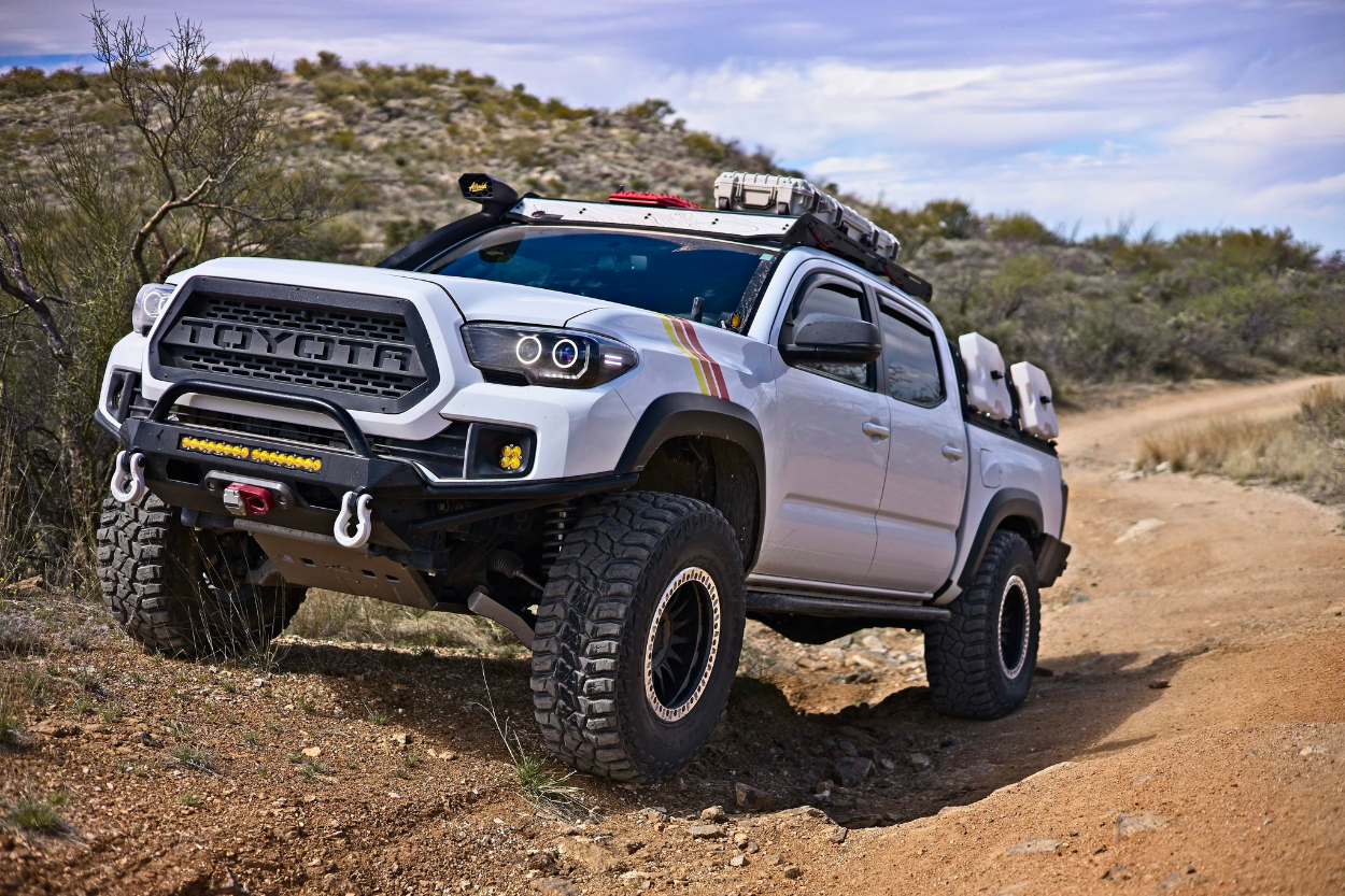 Lifted Super White 3rd Gen Tacoma with Cooper STT Pros 315/70R17 & RRW Wheels