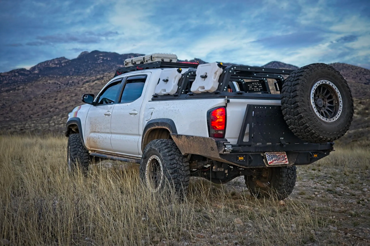 Super White Lifted 3rd Gen Tacoma With C4 Fabrication Overland Series High Clearance Rear Bumper 