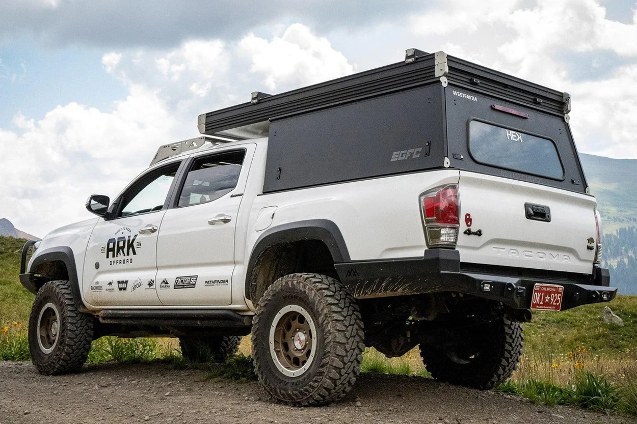 Backwoods Adventure Mods High Clearance Rear Bumper On Super White 3rd Gen (2016-Current) Tacoma with GFC Pop-Up Camper and Off-Road All-Terrain Tires