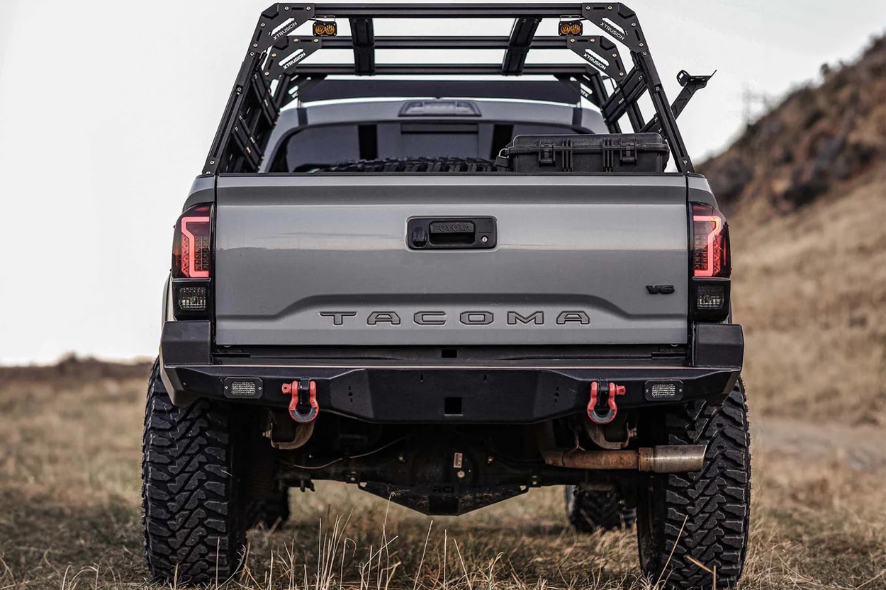 Backwoods Adventure Mods High Clearance Overland Rear Bumper with Off-Road Recovery Shackles, Flush Mounted Lights Pods, and Integrated Hitch Receiver on Cement Gray 3rd Gen Tacoma Off-Road Build